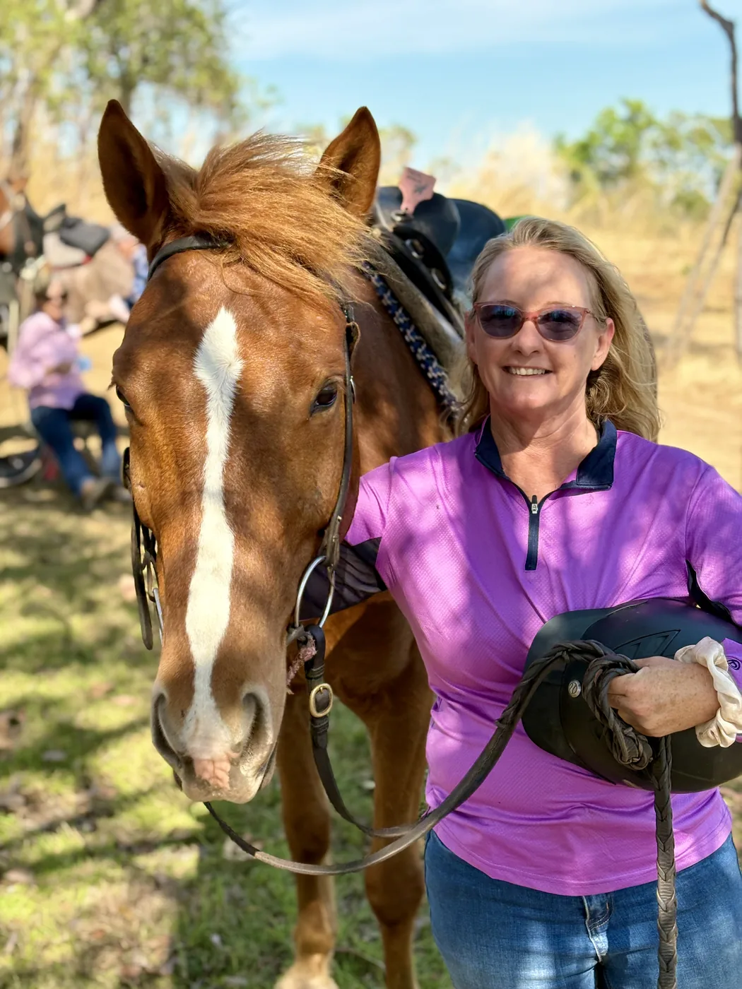 Lisa with a chestnut horse at an event
